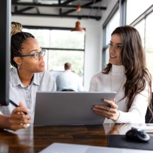 Young women exchanging small business consulting services