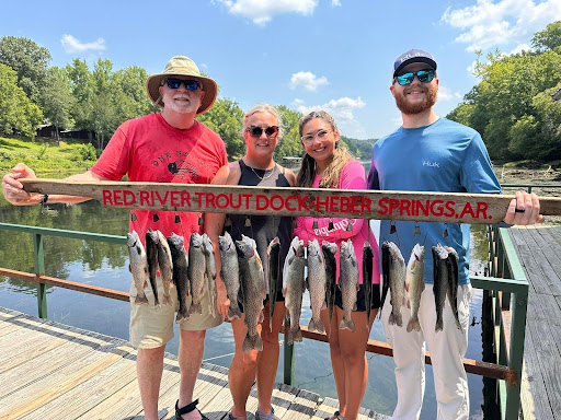 Happy customers with a day's catch at the Red River Trout Dock