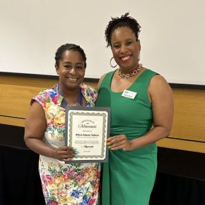 Adriene Brown (right) presents certificate to Smart Growth Fast Capital participant